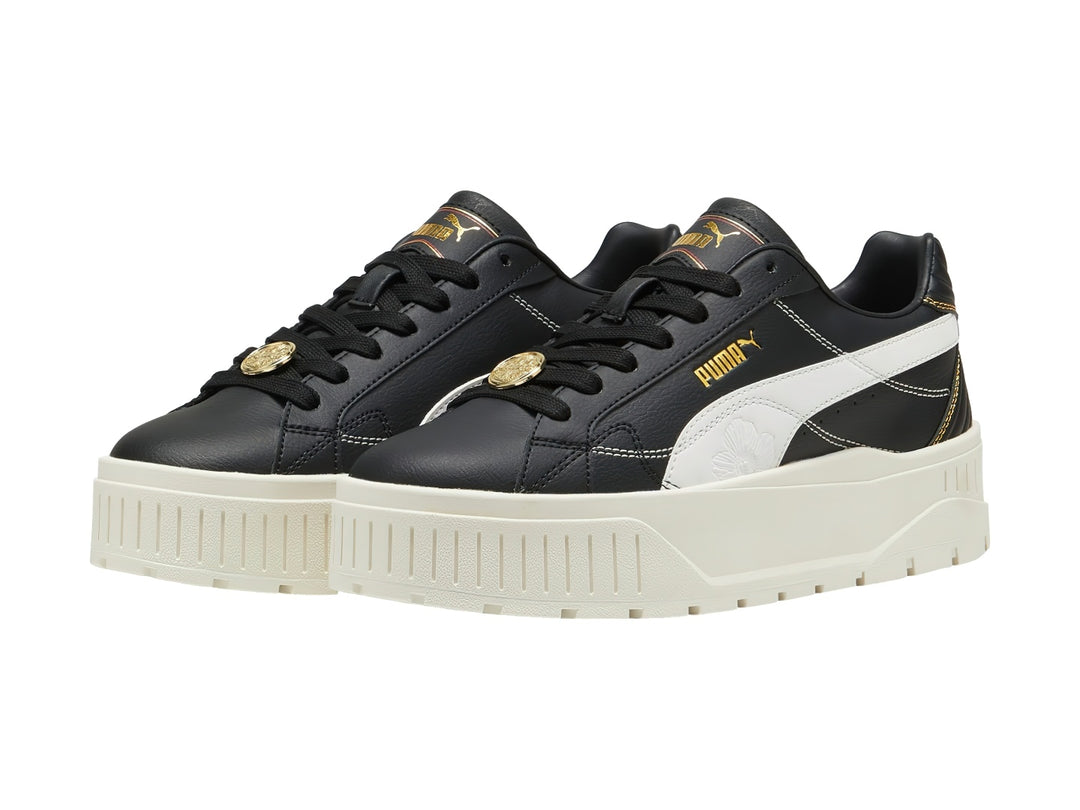 Tenis PUMA Carmen II Class Act en color negro con suela de plataforma blanca y detalles en dorado.