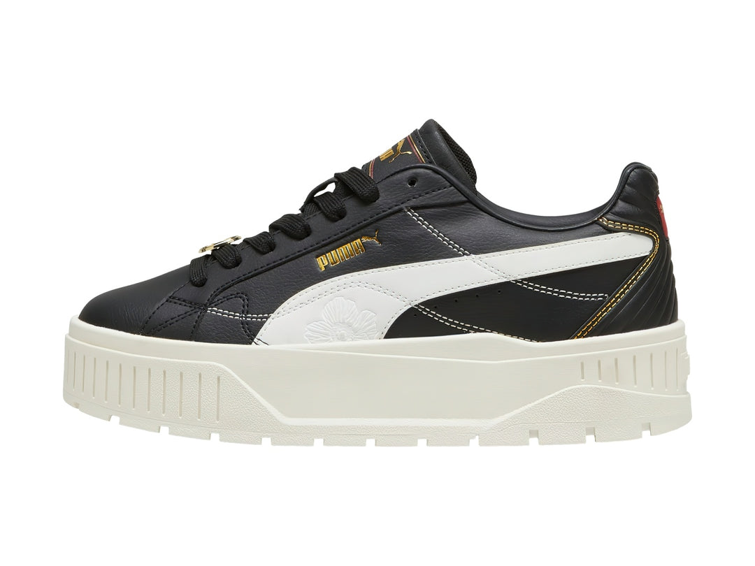Tenis PUMA Carmen II Class Act en color negro con suela de plataforma blanca y detalles en dorado.