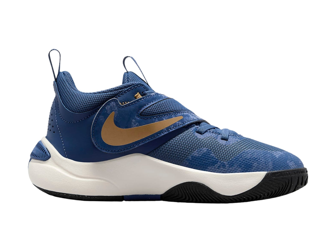 Tenis de baloncesto Nike color azul marino con suela blanca y logotipo dorado.