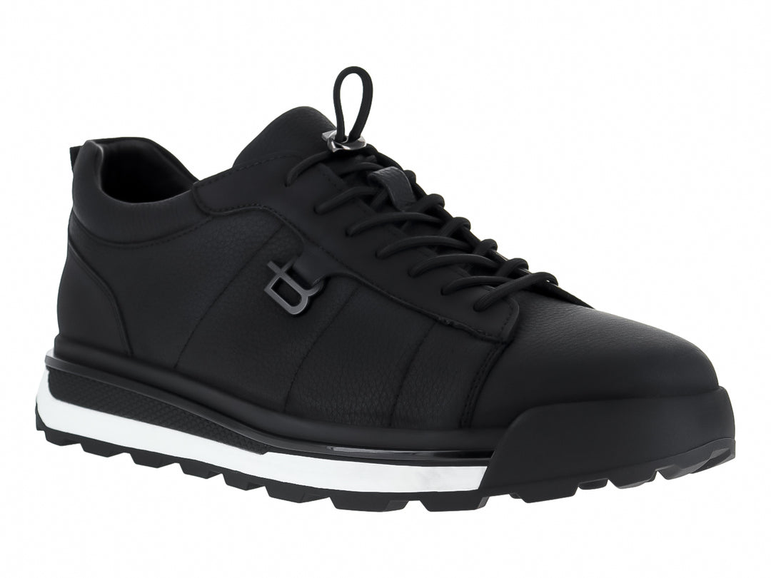 Tenis casuales de cuero color negro con suela blanca y detalles en negro para mujer.