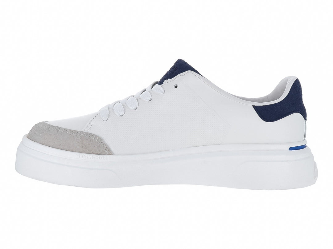Tenis Kenneth Cole Reaction en color blanco con detalles en azul marino y punta gris, suela blanca ancha.