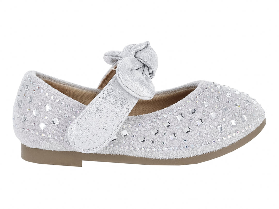Zapato plano plateado para Niña con moño decorativo y detalles brillantes.