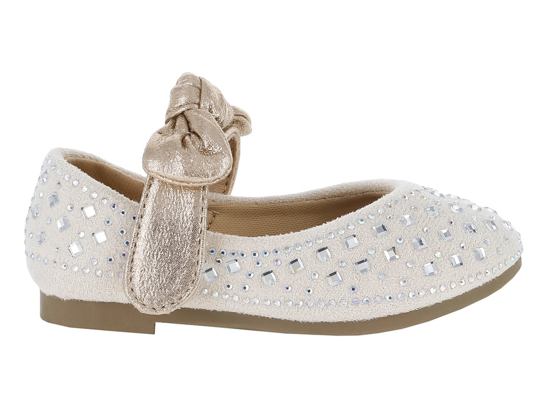 Zapato plano color champagne para niña con detalles de pedrería brillante y un moño decorativo en la parte superior.