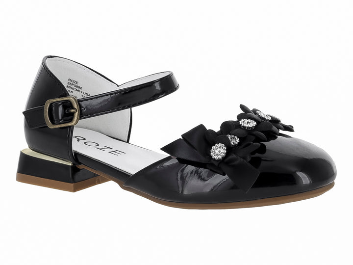 Zapato negro de charol para niña con moño decorativo, pedrerías y correa ajustable al tobillo.