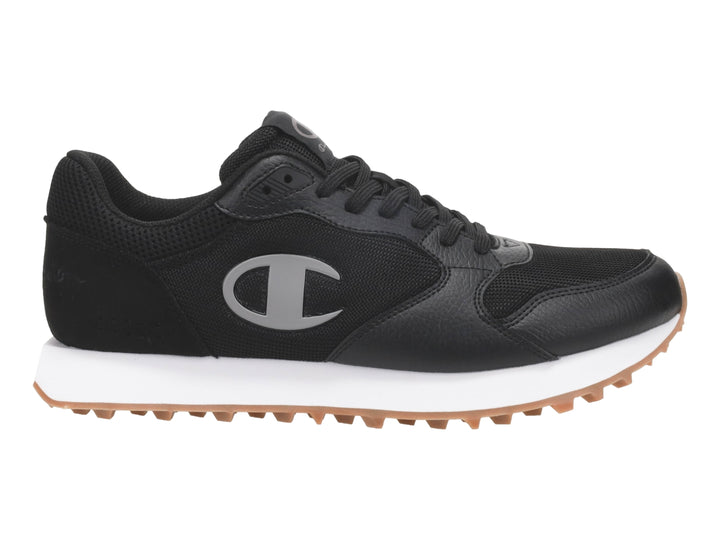Tenis Champion color negro con suela blanca y base de goma color miel.