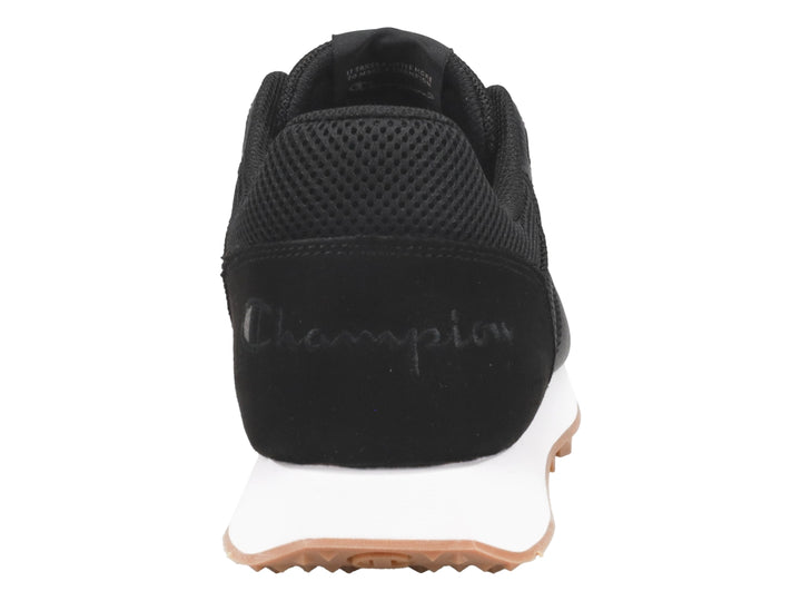 Tenis Champion color negro con suela blanca y base de goma color miel.