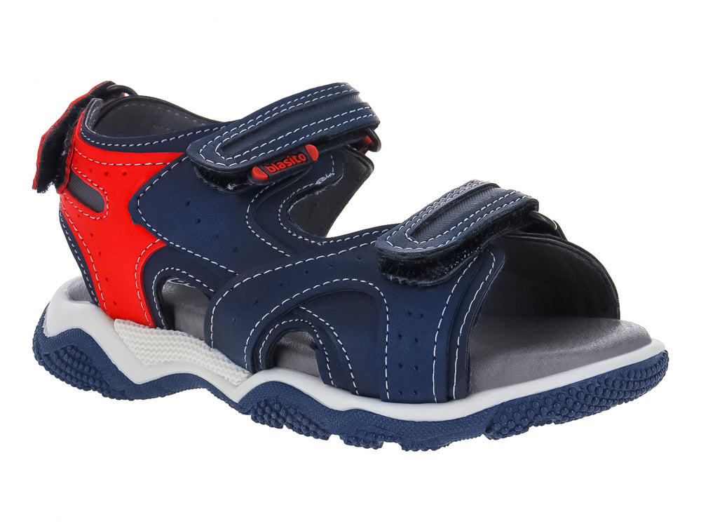 Sandalia deportiva para niño en color marino con detalles en rojo y gris, con cierres de velcro.