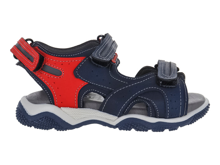 Sandalia infantil de color azul marino y rojo con suela gris y blanca.