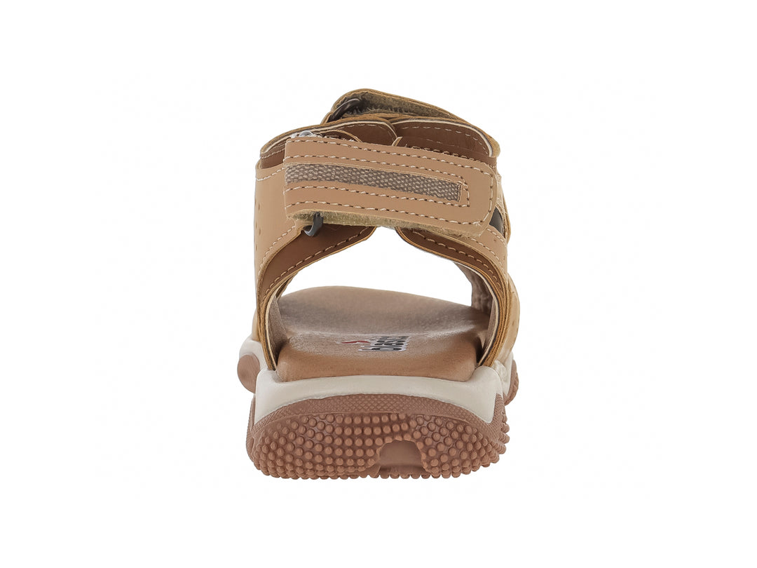 Sandalia infantil color camel con correas de velcro y suela robusta en tonos beige y café.