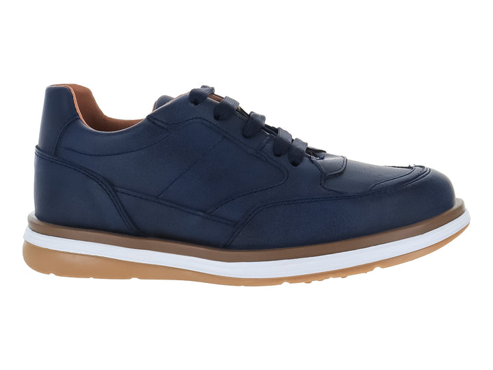 Zapato casual para niño en color azul marino con suela blanca y café.