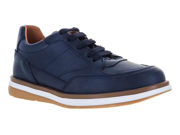 Zapato casual para niño en color azul marino con suela blanca y café.