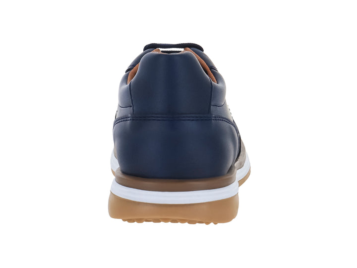 Zapato casual para niño en color azul marino con suela blanca y café.