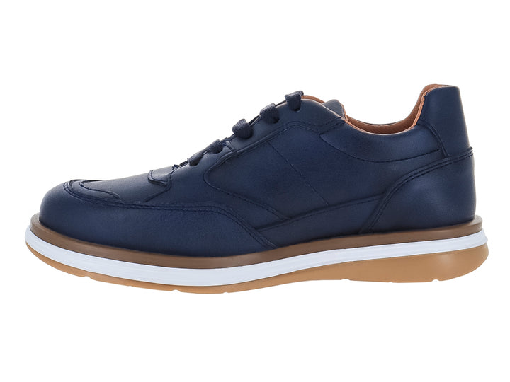 Zapato casual para niño en color azul marino con suela blanca y café.