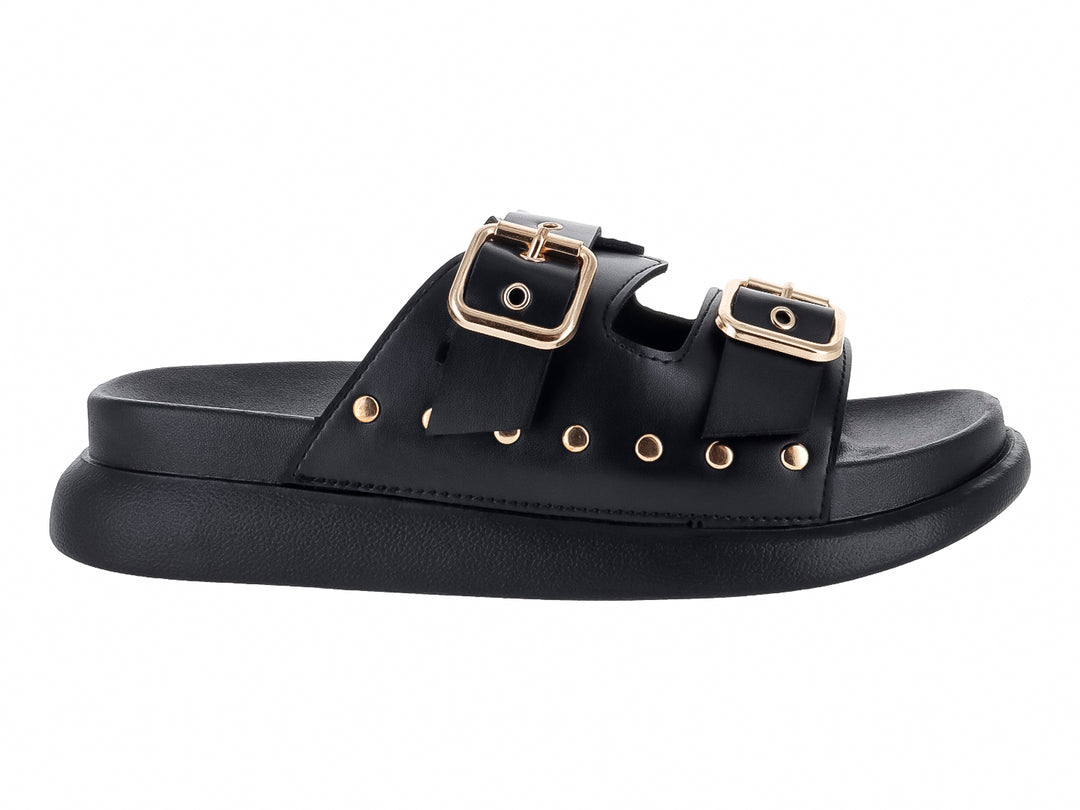 Sandalias negras de plataforma para niña con dos correas ajustables mediante hebillas doradas y detalles de ojetes.