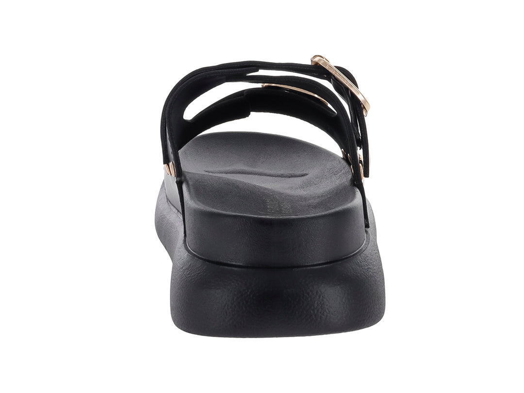 Sandalias negras de plataforma para niña con dos correas ajustables mediante hebillas doradas y detalles de ojetes.