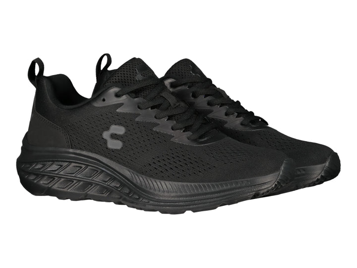 Tenis deportivos Charly en color negro total con suela gruesa y tejido transpirable.