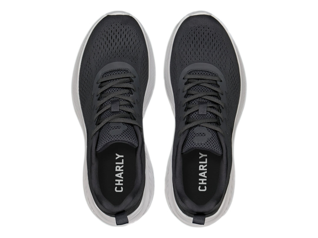 Tenis deportivos Charly color gris oxford con suela blanca y tejido transpirable.