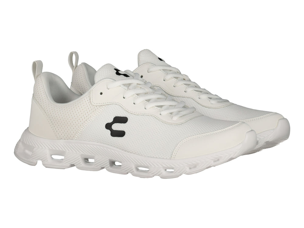 Tenis deportivos Charly de color blanco con logotipo negro en el costado y suela blanca.