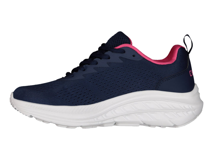 Tenis deportivos Charly color azul marino con detalles en fucsia y suela blanca.