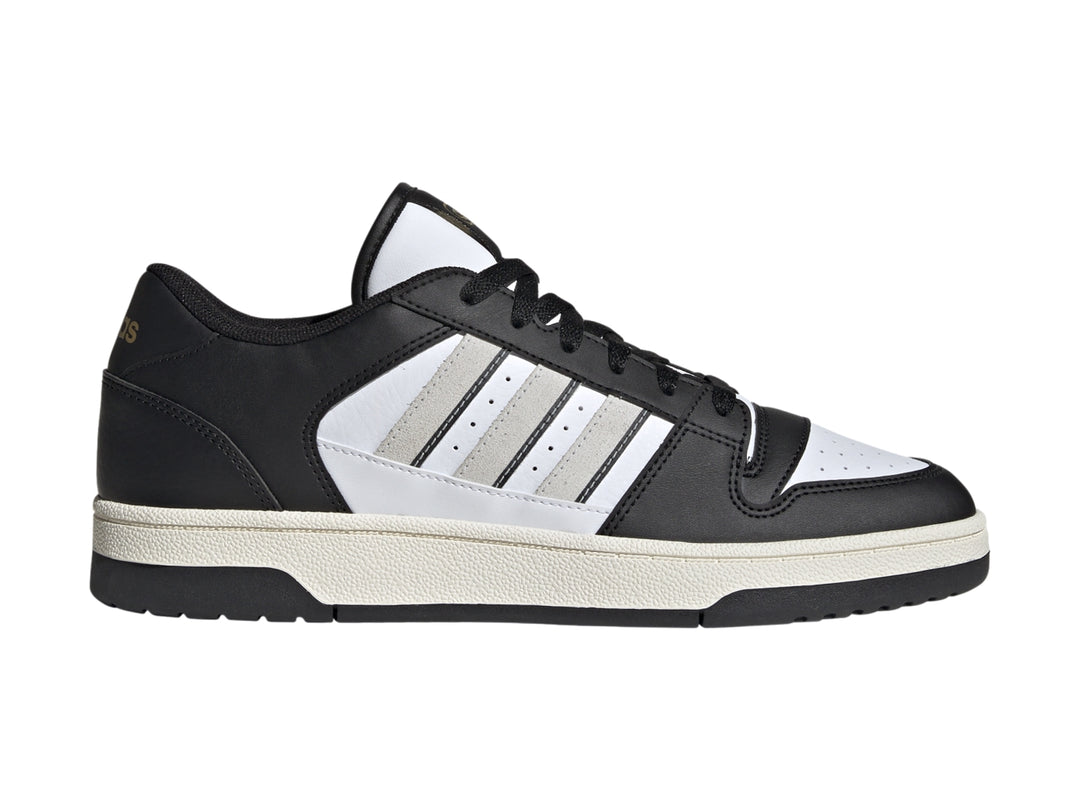 Tenis Adidas Break Start en colores negro y blanco con las tres franjas laterales características.