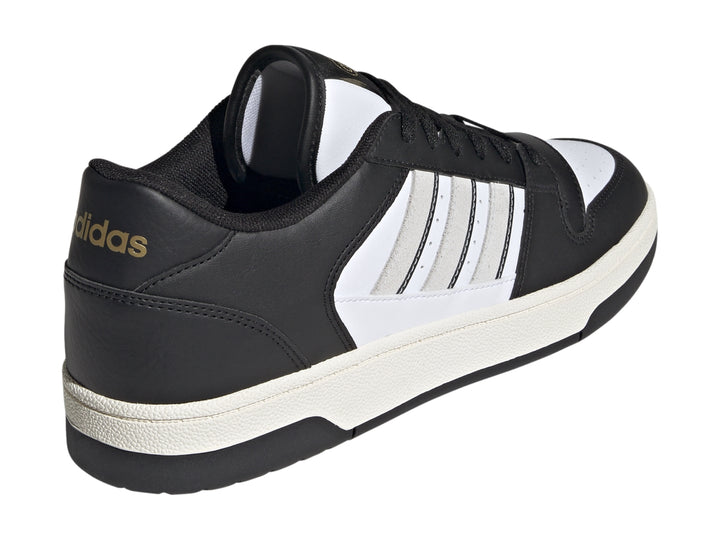 Tenis Adidas Break Start en colores negro y blanco con las tres franjas laterales características.