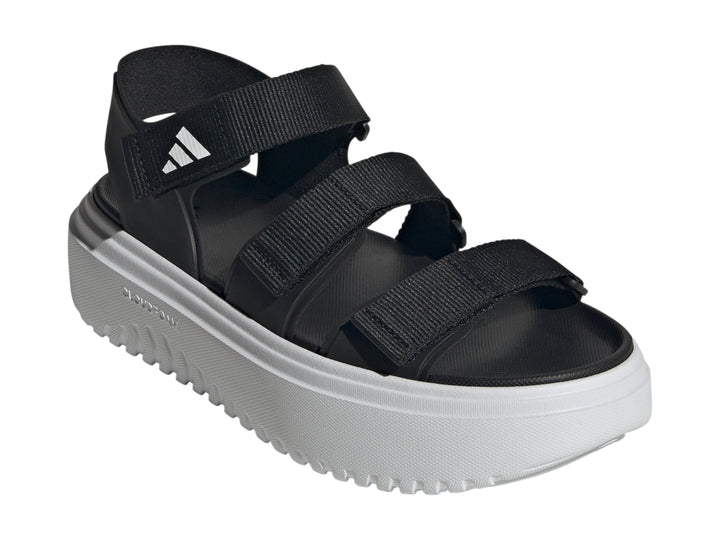 Sandalias Adidas Slyn negras con suela de plataforma blanca y correas ajustables.