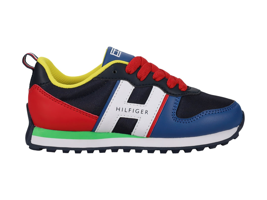 Tenis Tommy Hilfiger modelo Jogger en colores azul, rojo, blanco y amarillo para niño.