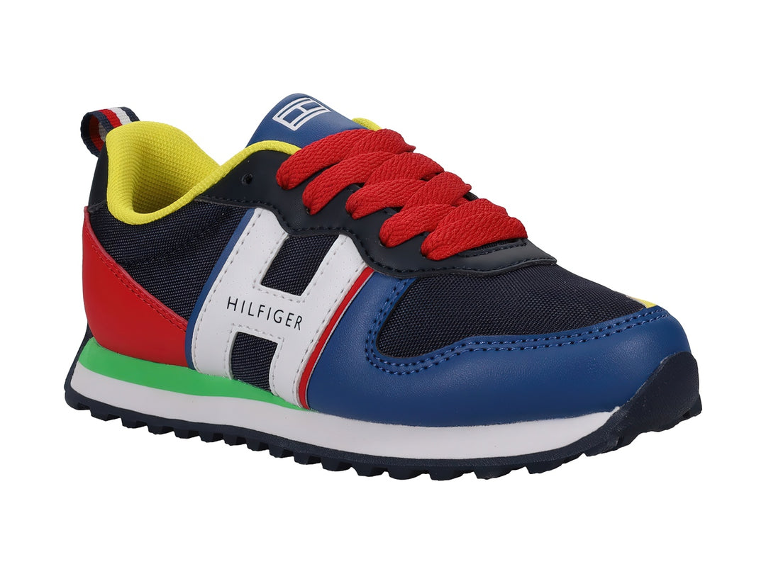 Tenis Tommy Hilfiger modelo Jogger en colores azul, rojo, blanco y amarillo para niño.