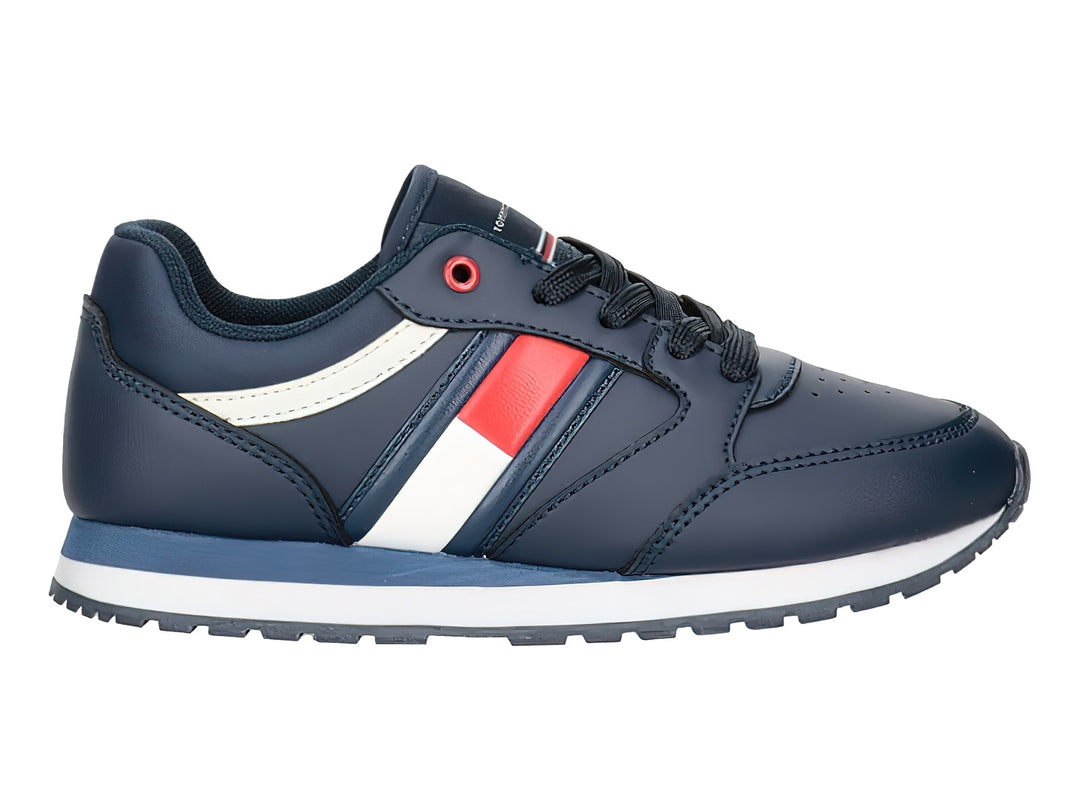 Tenis Tommy Hilfiger azul marino con detalles en blanco y rojo y suela blanca.