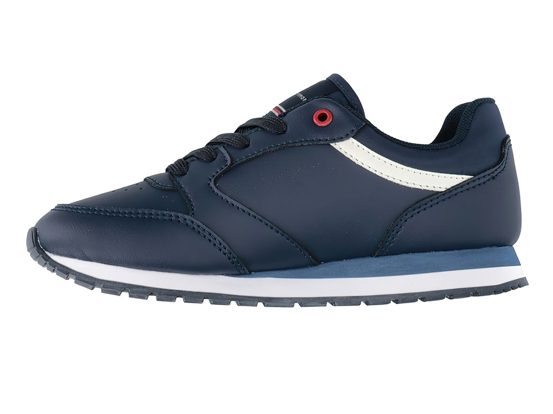 Tenis Tommy Hilfiger azul marino con detalles en blanco y rojo y suela blanca.