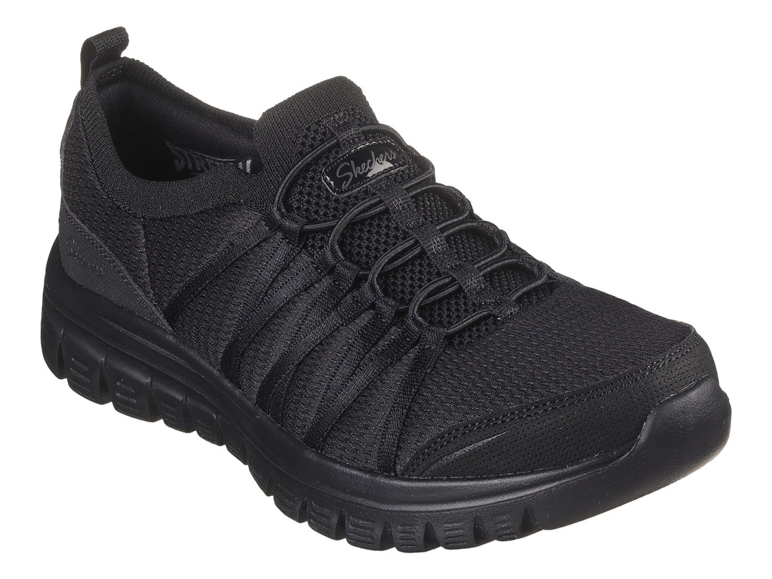 Tenis deportivos Skechers color negro con suela gruesa y tejido transpirable.