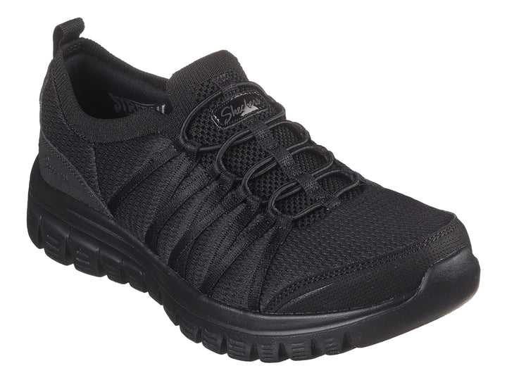 Tenis deportivos Skechers color negro con suela gruesa y tejido transpirable.