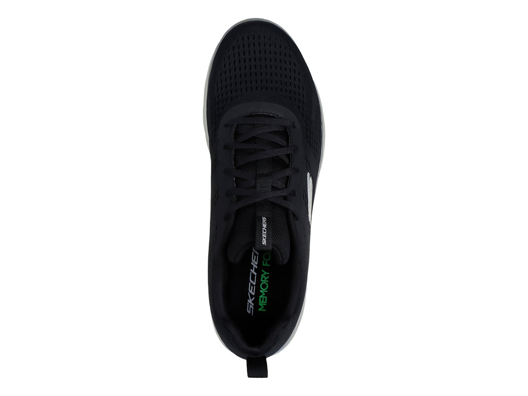 Tenis deportivos Skechers color negro con suela blanca y logotipo lateral en blanco.