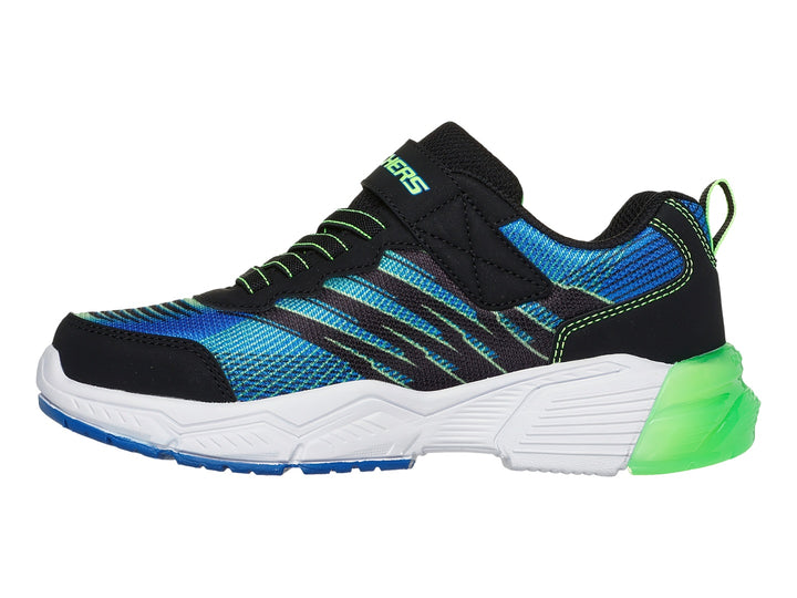 Tenis deportivos Skechers para niño en colores azul, negro y lima con suela blanca y verde.
