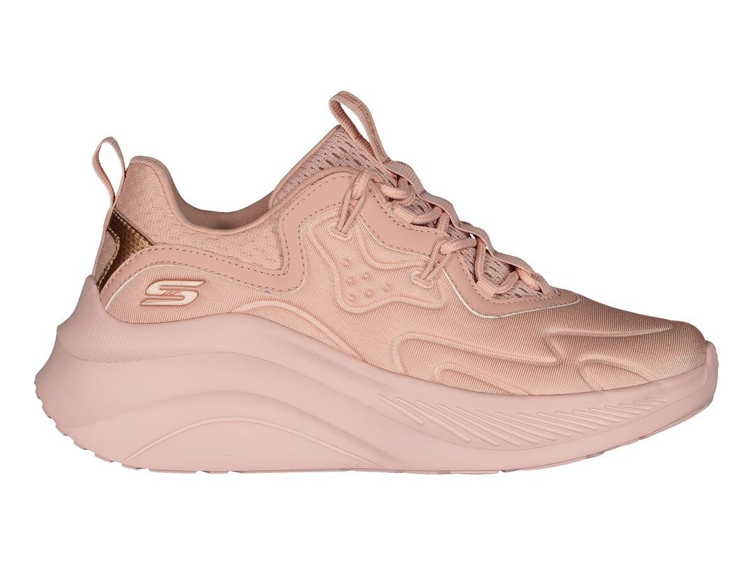Tenis Skechers color rosa blush con suela gruesa y detalle metálico en el talón.