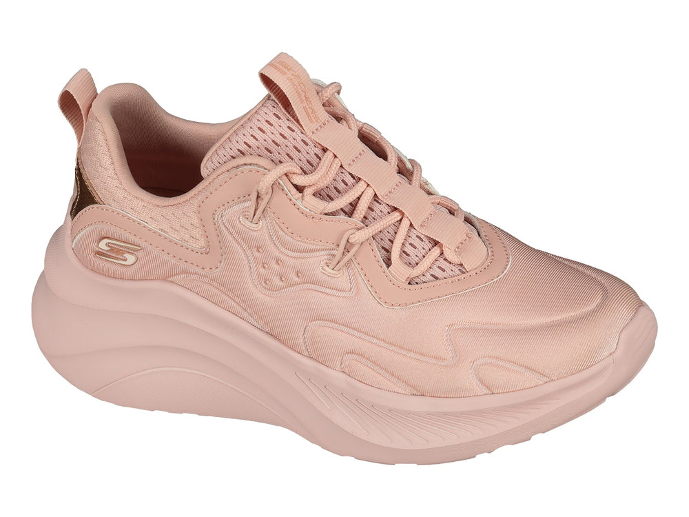 Tenis Skechers color rosa blush con suela gruesa y detalle metálico en el talón.