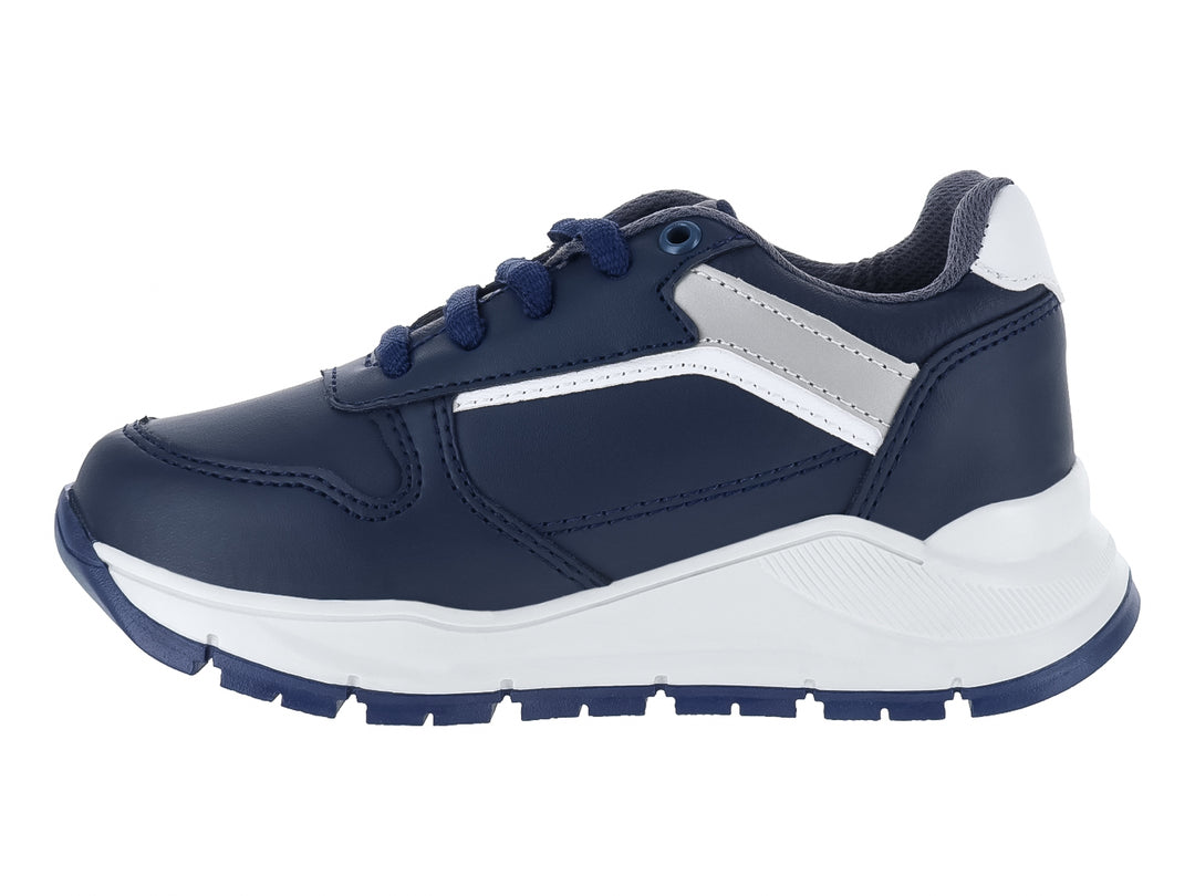 Zapato casual para niño marca Guany en color azul marino con suela blanca y detalles en gris.