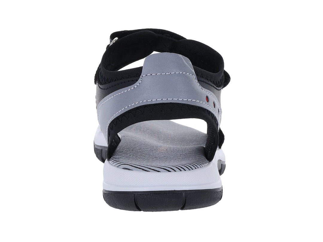Sandalia infantil YUYIN color negro con suela blanca y detalles en gris.