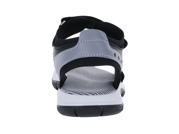 Sandalia infantil YUYIN color negro con suela blanca y detalles en gris.