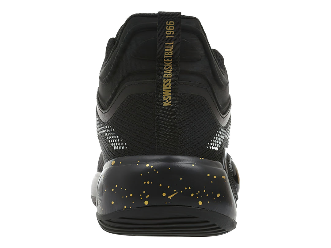Tenis deportivos K-Swiss color negro con detalles dorados y patrón de puntos blancos.
