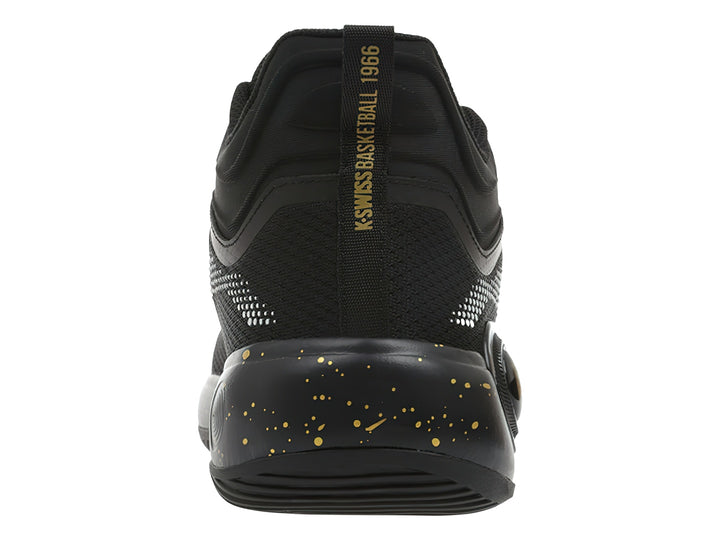 Tenis deportivos K-Swiss color negro con detalles dorados y patrón de puntos blancos.