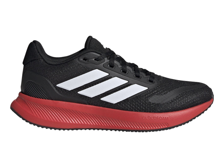 Tenis deportivos Adidas color negro con suela roja y franjas blancas laterales.