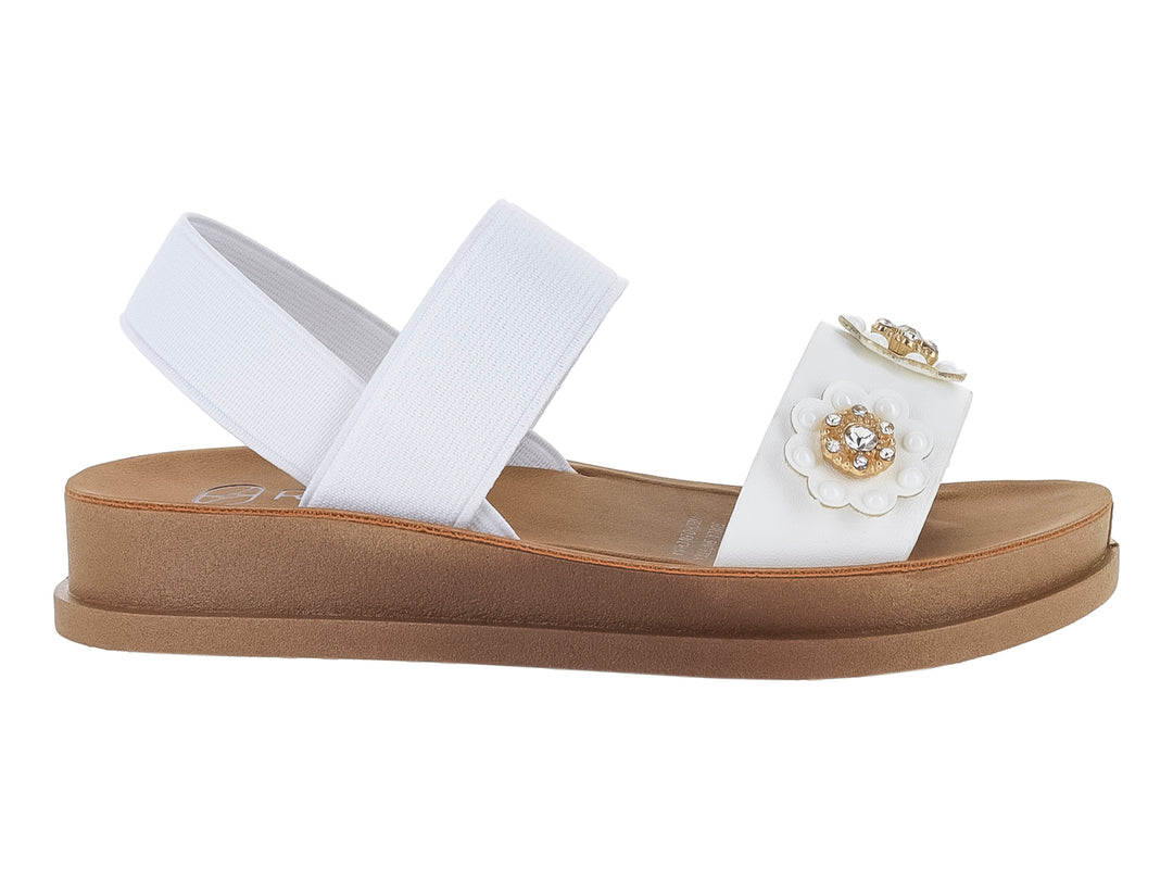 Sandalia de plataforma blanca con suela marrón y adorno de flor en la correa frontal.
