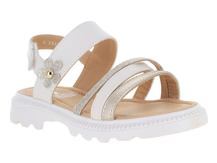 Sandalia blanca para niña con detalle de flor brillante y tiras plateadas sobre suela blanca dentada.