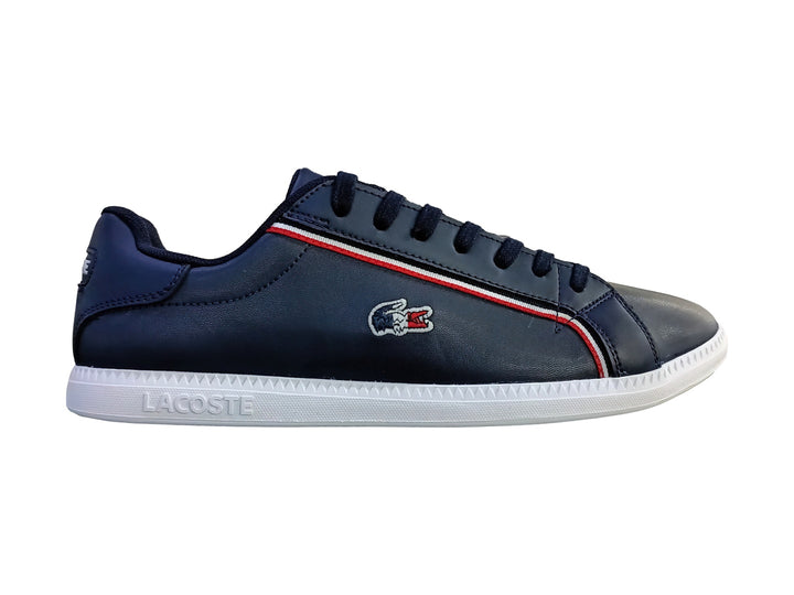 Tenis Lacoste Graduate en color azul marino con suela blanca y franja decorativa roja y blanca lateral.