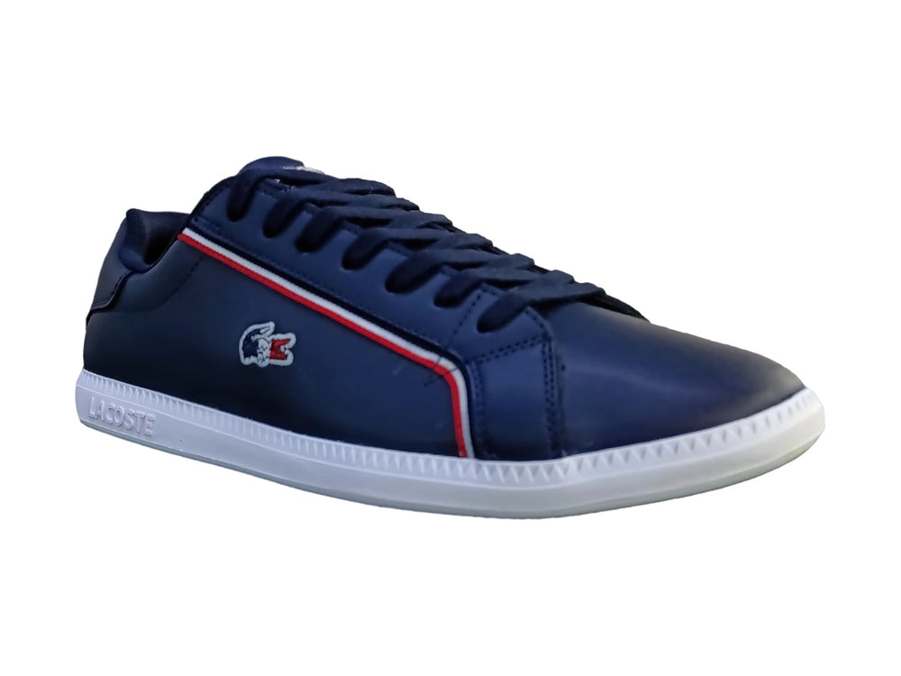 Tenis Lacoste Graduate en color azul marino con suela blanca y franja decorativa roja y blanca lateral.