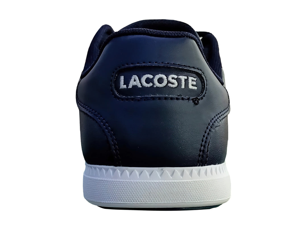 Tenis Lacoste Graduate en color azul marino con suela blanca y franja decorativa roja y blanca lateral.