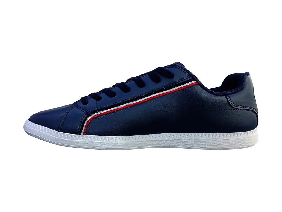 Tenis Lacoste Graduate en color azul marino con suela blanca y franja decorativa roja y blanca lateral.