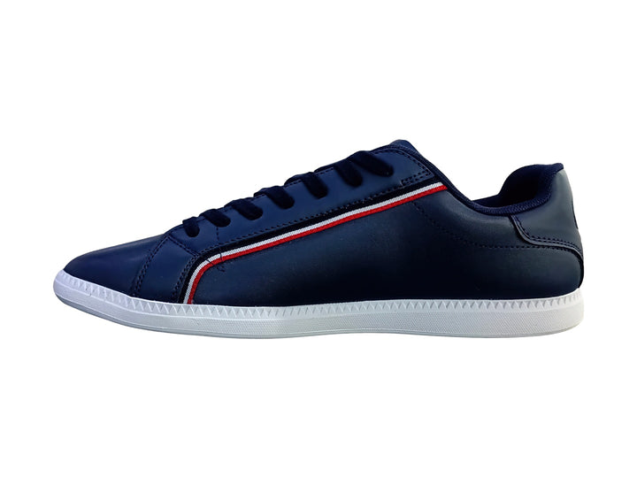 Tenis Lacoste Graduate en color azul marino con suela blanca y franja decorativa roja y blanca lateral.