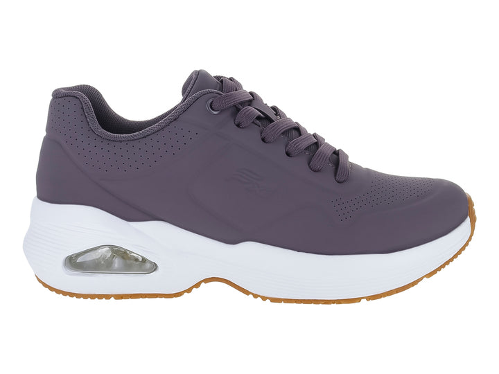 Tenis Flexi color lila con suela blanca y detalle de cámara de aire en el talón.